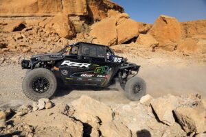 Mike Cafro's Team OBOR Factory Polaris RZR charging in the rocks
